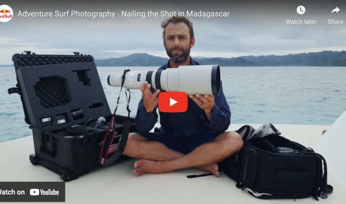 video cover image of the video showing a photographer holding a camera lens