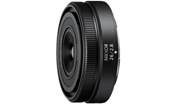 a studio image of a NIKKOR 26mm lens