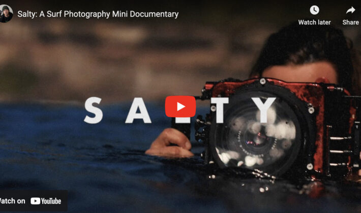video cover image of a photographer holding an underwater housing in the water