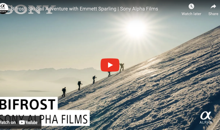 video cover image of skiers hiking up a mountain