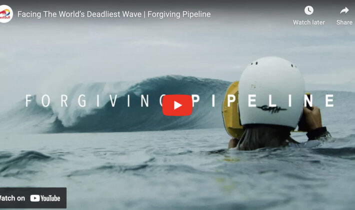 video cover image of a photographer in the water taking photos of a surfer on a wave