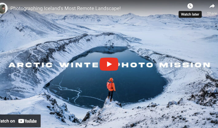video cover image of a man in the snow looking at a lake